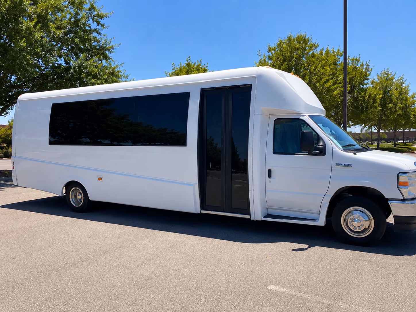 Wedding guests seated inside a Albuquerque party bus